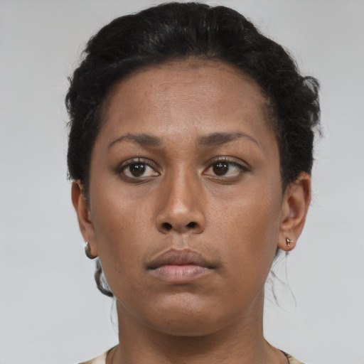 Neutral latino young-adult female with short  brown hair and brown eyes