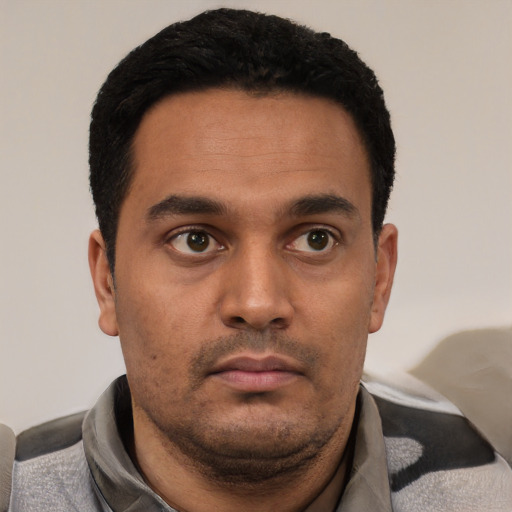 Neutral black young-adult male with short  black hair and brown eyes