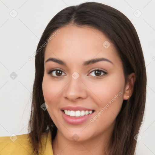 Joyful white young-adult female with long  brown hair and brown eyes