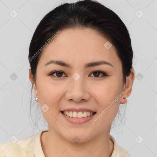 Joyful asian young-adult female with medium  brown hair and brown eyes