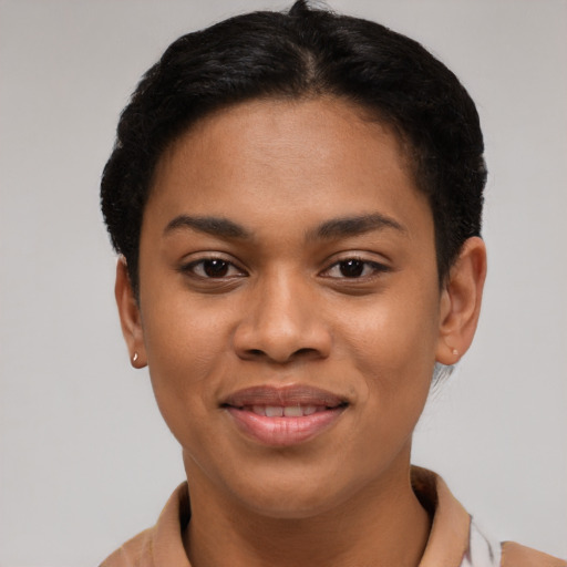 Joyful latino young-adult female with short  brown hair and brown eyes