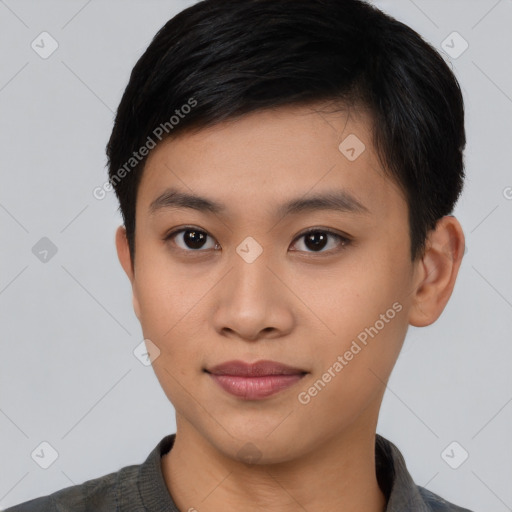 Joyful asian young-adult male with short  black hair and brown eyes