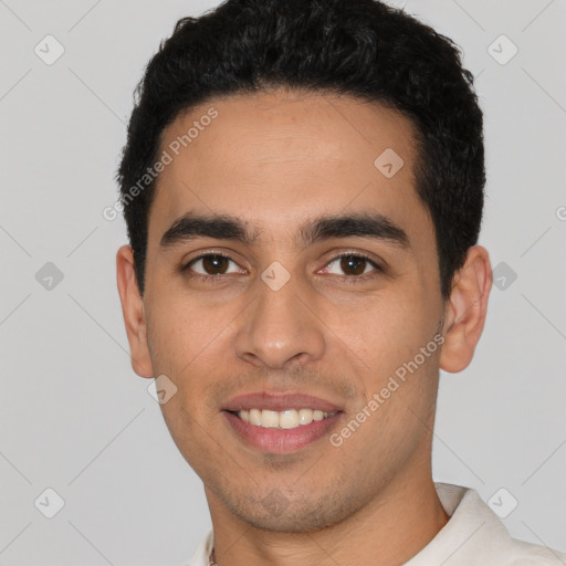 Joyful white young-adult male with short  black hair and brown eyes