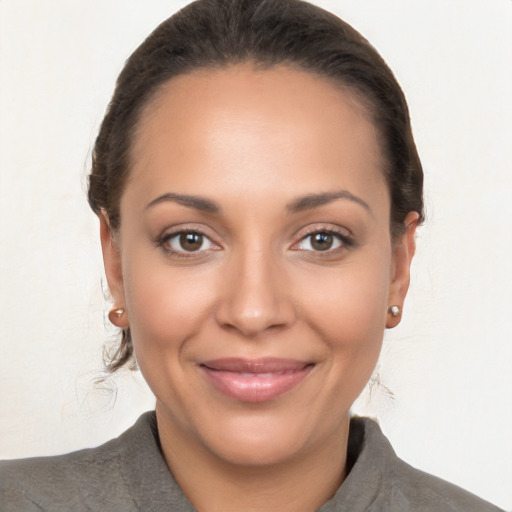 Joyful white young-adult female with medium  brown hair and brown eyes