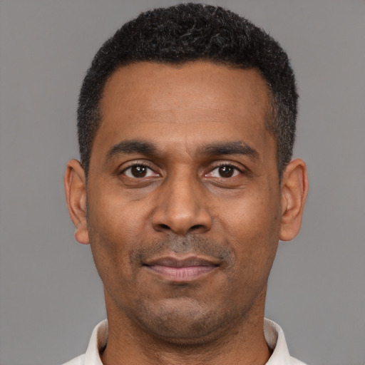Neutral latino adult male with short  black hair and brown eyes