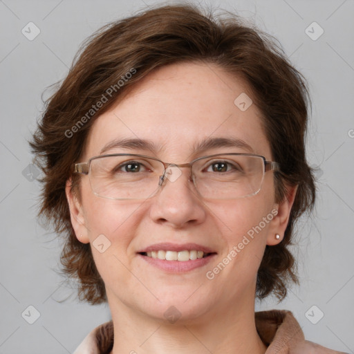 Joyful white adult female with medium  brown hair and blue eyes