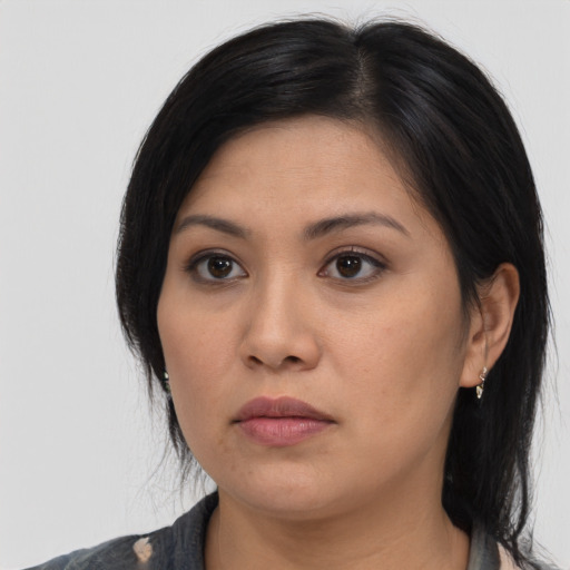 Neutral asian young-adult female with medium  brown hair and brown eyes