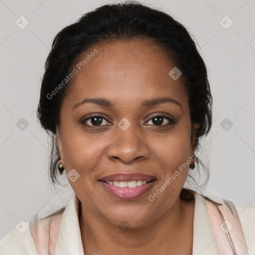 Joyful black adult female with medium  brown hair and brown eyes