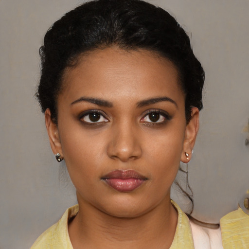 Neutral black young-adult female with short  brown hair and brown eyes