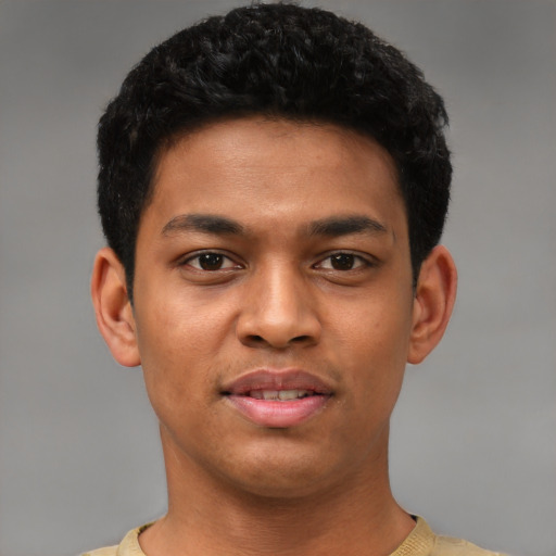 Joyful latino young-adult male with short  black hair and brown eyes