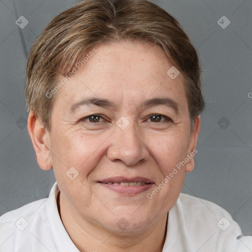 Joyful white adult female with short  brown hair and brown eyes