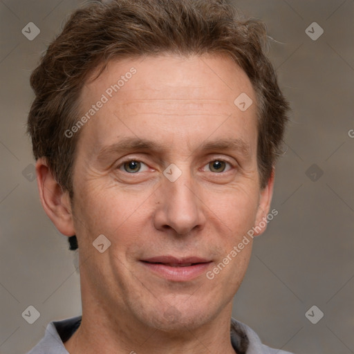 Joyful white adult male with short  brown hair and grey eyes