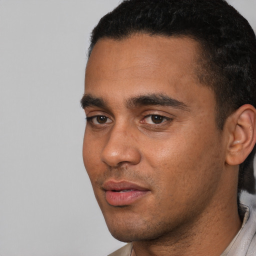 Neutral latino young-adult male with short  black hair and brown eyes