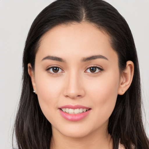 Joyful white young-adult female with long  brown hair and brown eyes