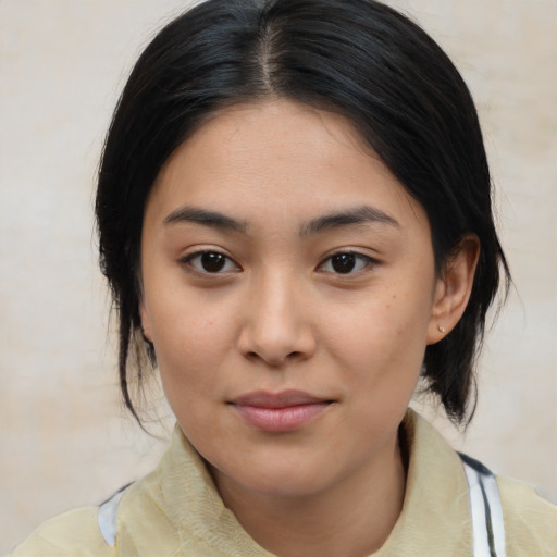 Joyful latino young-adult female with medium  black hair and brown eyes