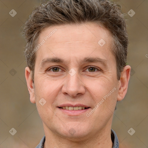 Joyful white adult male with short  brown hair and brown eyes