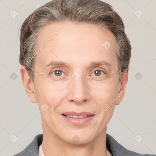 Joyful white adult male with short  brown hair and grey eyes