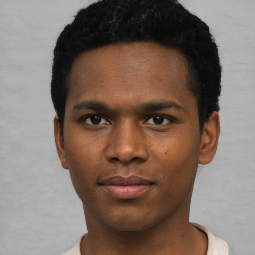 Neutral black young-adult male with short  black hair and brown eyes
