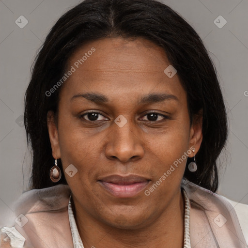 Joyful black adult female with medium  brown hair and brown eyes