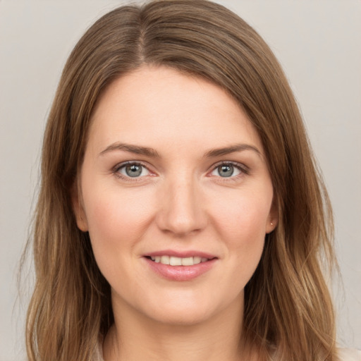 Joyful white young-adult female with medium  brown hair and grey eyes