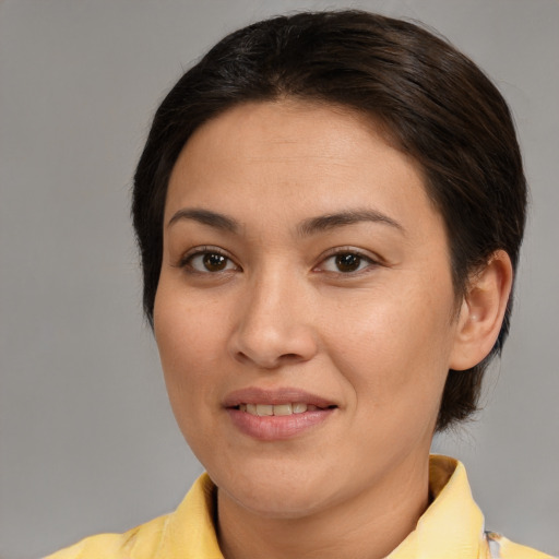 Joyful asian young-adult female with medium  brown hair and brown eyes