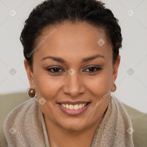 Joyful black young-adult female with short  brown hair and brown eyes