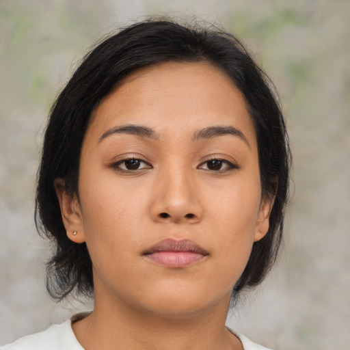 Neutral asian young-adult female with medium  brown hair and brown eyes