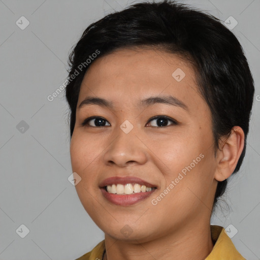 Joyful asian young-adult female with medium  black hair and brown eyes