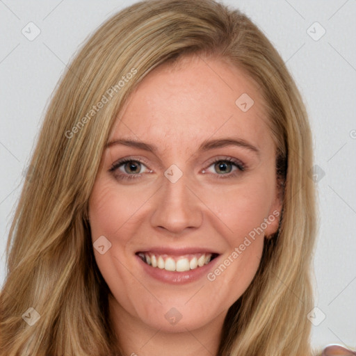 Joyful white young-adult female with long  brown hair and brown eyes