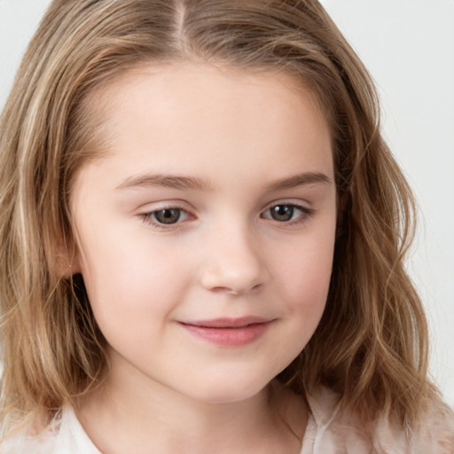 Joyful white child female with medium  brown hair and grey eyes