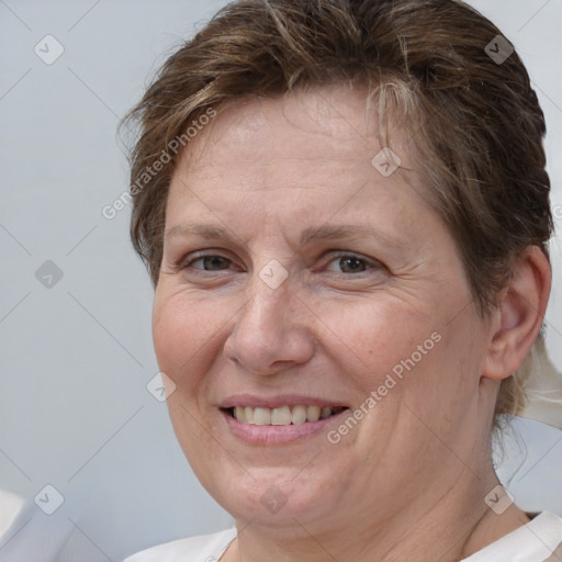 Joyful white adult female with short  brown hair and brown eyes