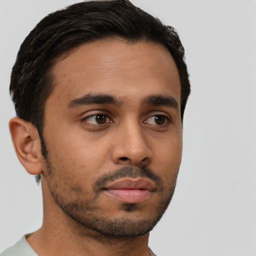Neutral latino young-adult male with short  black hair and brown eyes