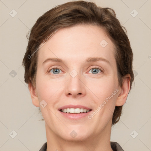 Joyful white young-adult female with short  brown hair and grey eyes