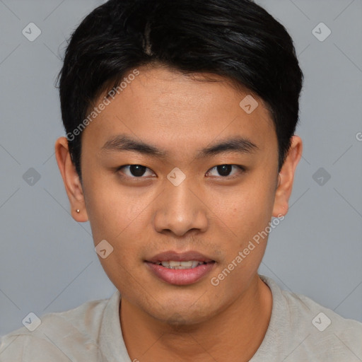 Joyful asian young-adult male with short  black hair and brown eyes