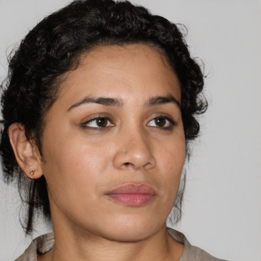 Neutral latino young-adult female with short  brown hair and brown eyes