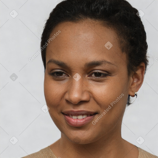 Joyful black young-adult female with short  brown hair and brown eyes