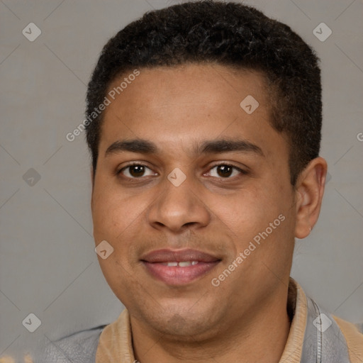 Joyful black young-adult male with short  brown hair and brown eyes