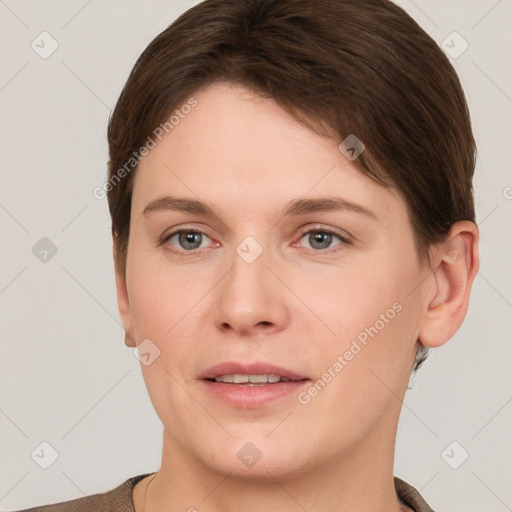 Joyful white young-adult female with short  brown hair and grey eyes