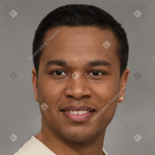 Joyful latino young-adult male with short  brown hair and brown eyes