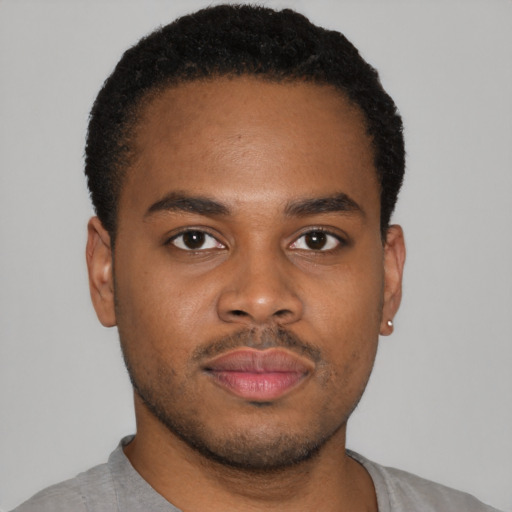 Neutral latino young-adult male with short  brown hair and brown eyes