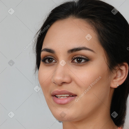 Joyful latino young-adult female with medium  brown hair and brown eyes