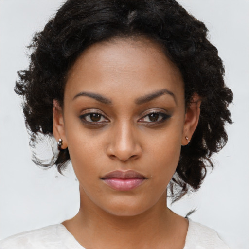 Neutral black young-adult female with long  brown hair and brown eyes