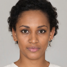 Neutral black young-adult female with short  brown hair and brown eyes