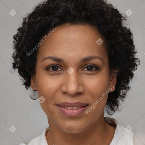 Joyful black adult female with short  brown hair and brown eyes