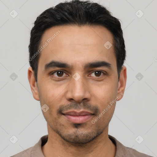 Joyful latino young-adult male with short  black hair and brown eyes