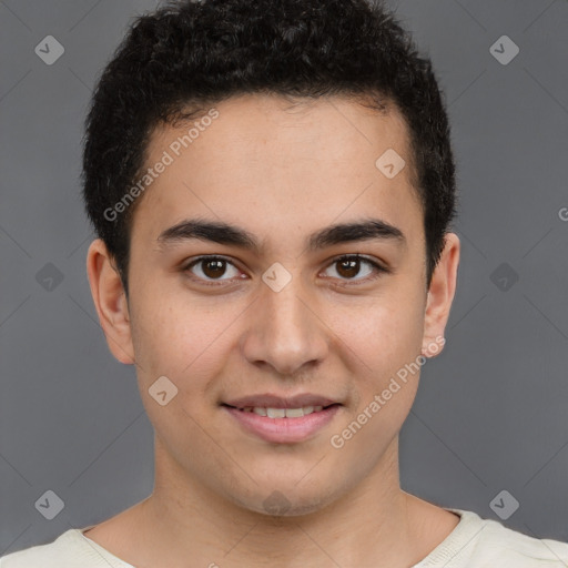 Joyful latino young-adult male with short  brown hair and brown eyes