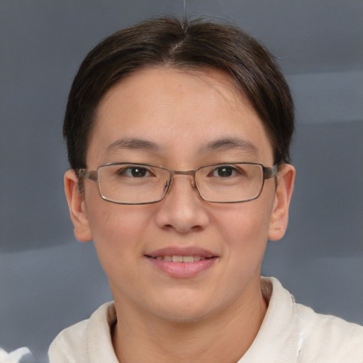 Joyful white adult female with short  brown hair and brown eyes