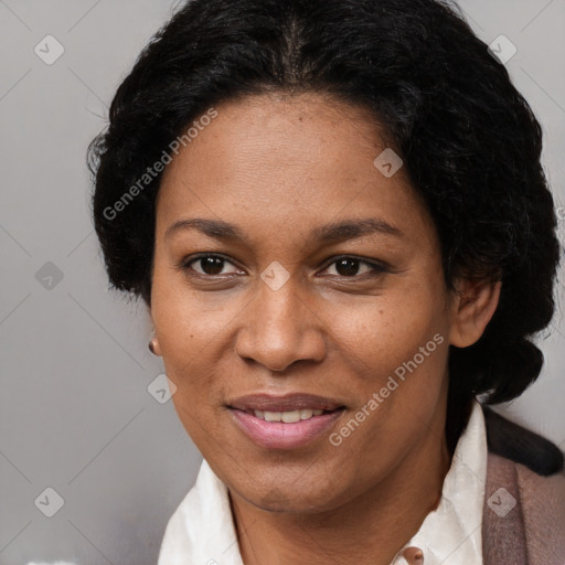 Joyful black adult female with short  brown hair and brown eyes