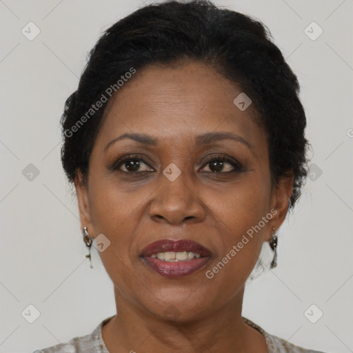 Joyful black adult female with short  brown hair and brown eyes