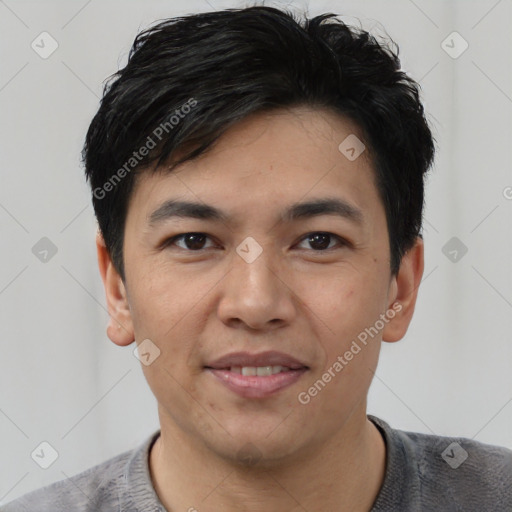 Joyful asian young-adult male with short  black hair and brown eyes